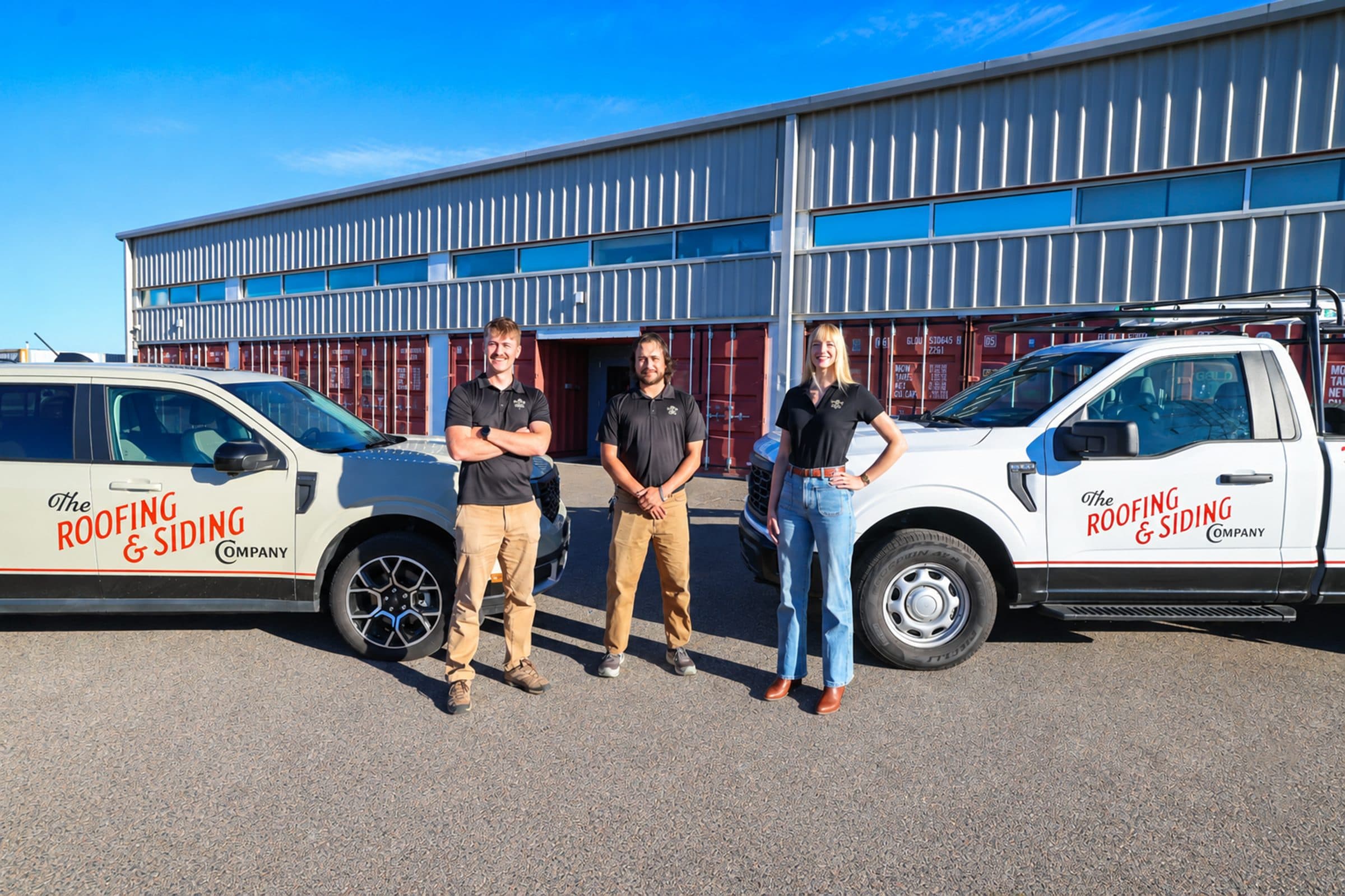 The Roofing & Siding Company team with their trucks outside the shop at 6145 Broadway, Denver, CO