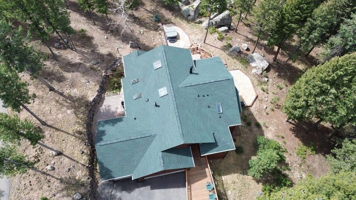 Aerial view of a completed roof replacement on a Denver Colorado home with new asphalt shingles
