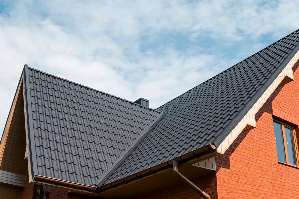 Metal roof installation on brick home in Denver